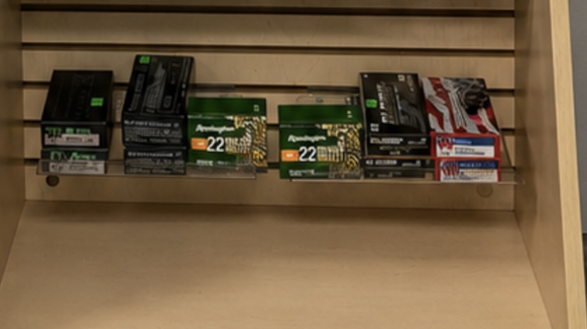Ammunition boxes on display shelf