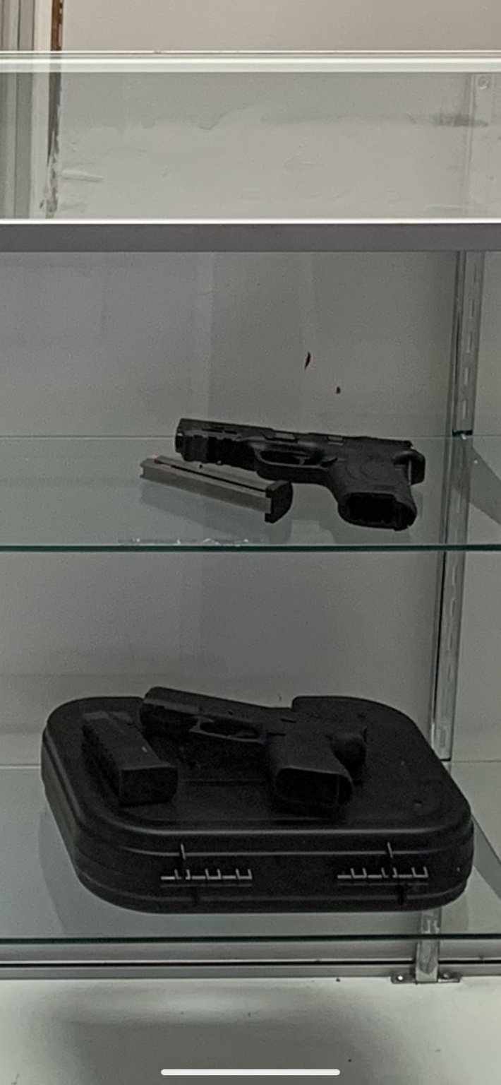 Pistols inside glass display case